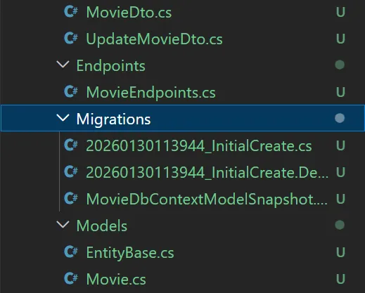 Entity Framework Core 10 code-first migrations folder structure displaying InitialCreate migration files with ModelSnapshot designer file and database context configuration in Visual Studio 2026 solution explorer
